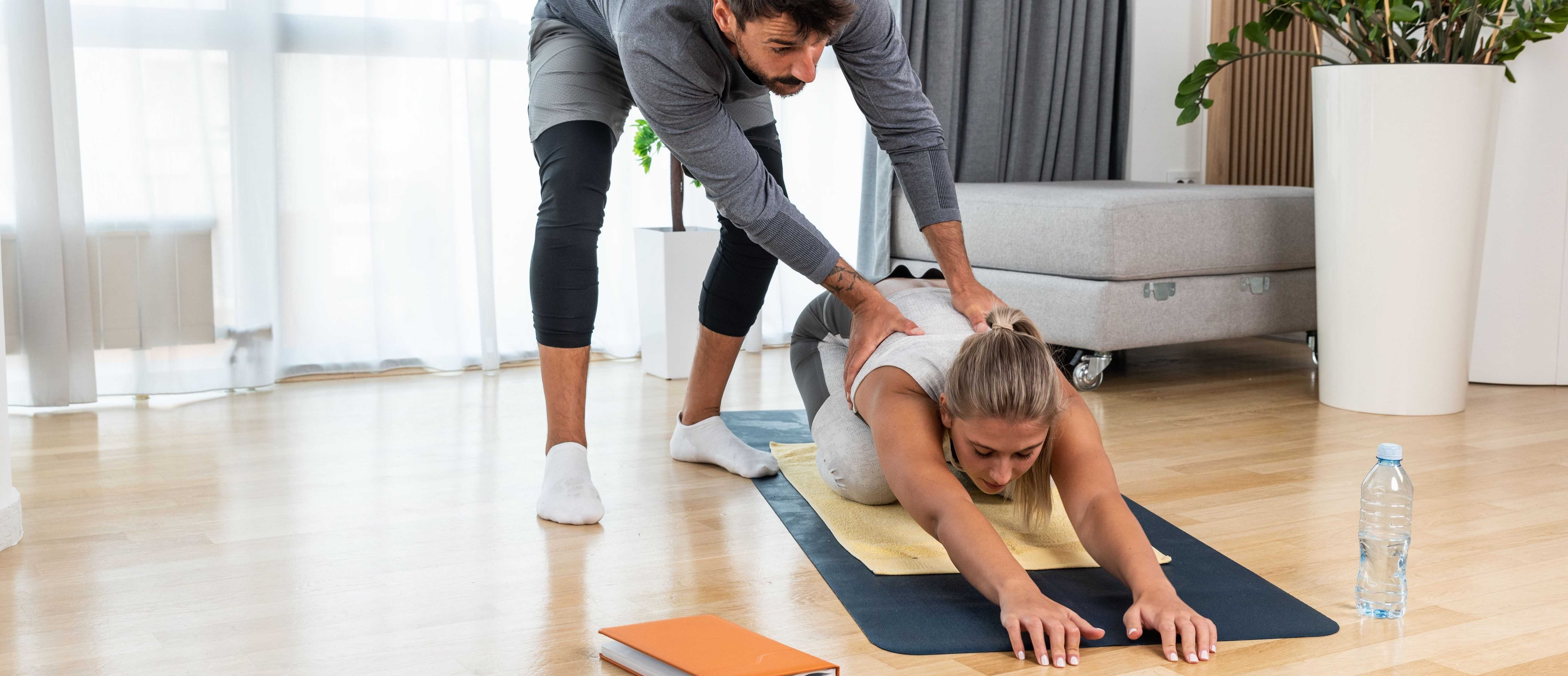 People doing squats in group pt sessions gym class